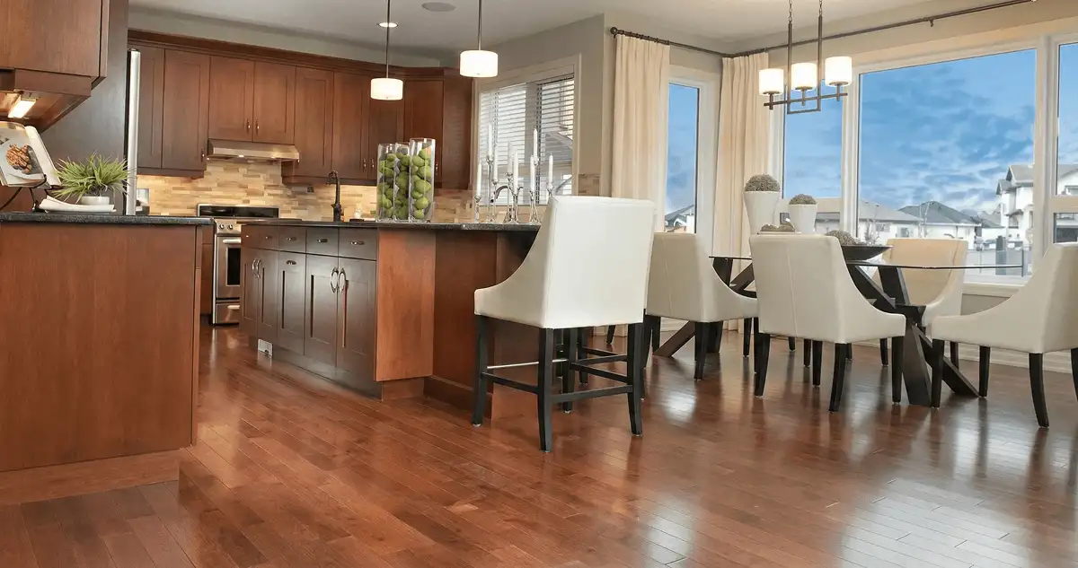 A modern kitchen with professionally installed wood flooring in Phoenix, AZ