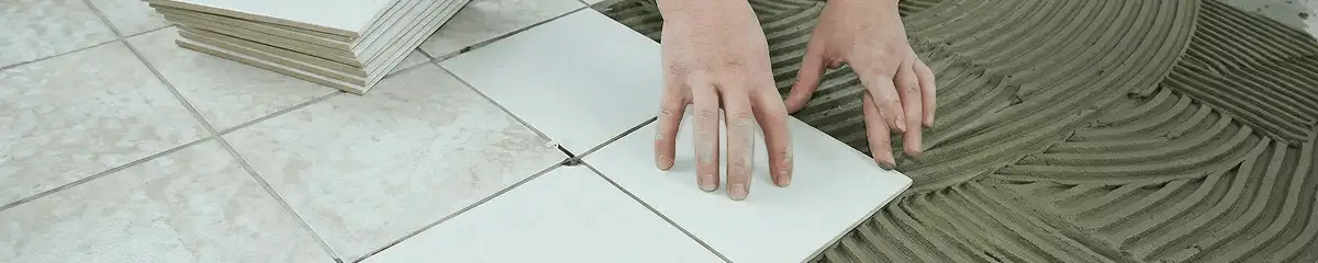Professional installing white tile floors in Phoenix, AZ