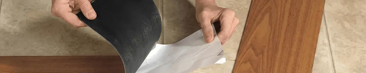 A professional installing vinyl flooring in Phoenix, AZ